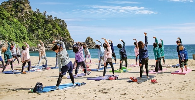 Care for your body with beach yoga's picture